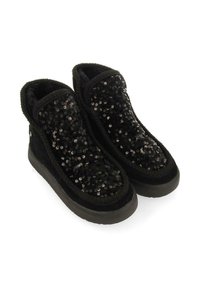 Botas negras con lentejuelas hasta el tobillo, con un upper de tela suave, texturizado con lentejuelas y una suela de goma para mayor tracción. Cuenta con un forro acogedor.