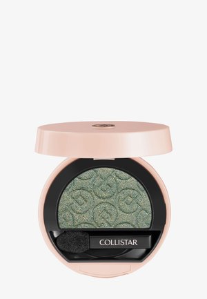Round light pink compact with shimmery green eyeshadow embossed with logos and a black applicator labeled "Collistar."