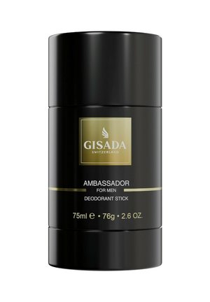 Déodorant stick cylindrique noir étiqueté "Gisada Switzerland Ambassador pour hommes", 75ml, 76g, avec texte doré et blanc sur fond blanc.