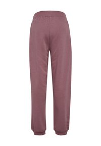 Bordeauxfarbene Jogginghosen aus weichem Stoff, mit einem elastischen Bund und gerippten Knöcheln, die für Komfort und Bewegungsfreiheit konzipiert sind.