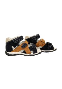 Due paia di sandali per bambini con tomaie in suede blu e sabbia, cinturini in Velcro regolabili e suole bianche, con un design traspirante.