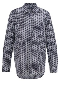 Skjorta med knäppning och fjärilsdesign i lila och vitt. Långa ärmar, krage och rak nederkant. Tillverkad av lätt tyg.