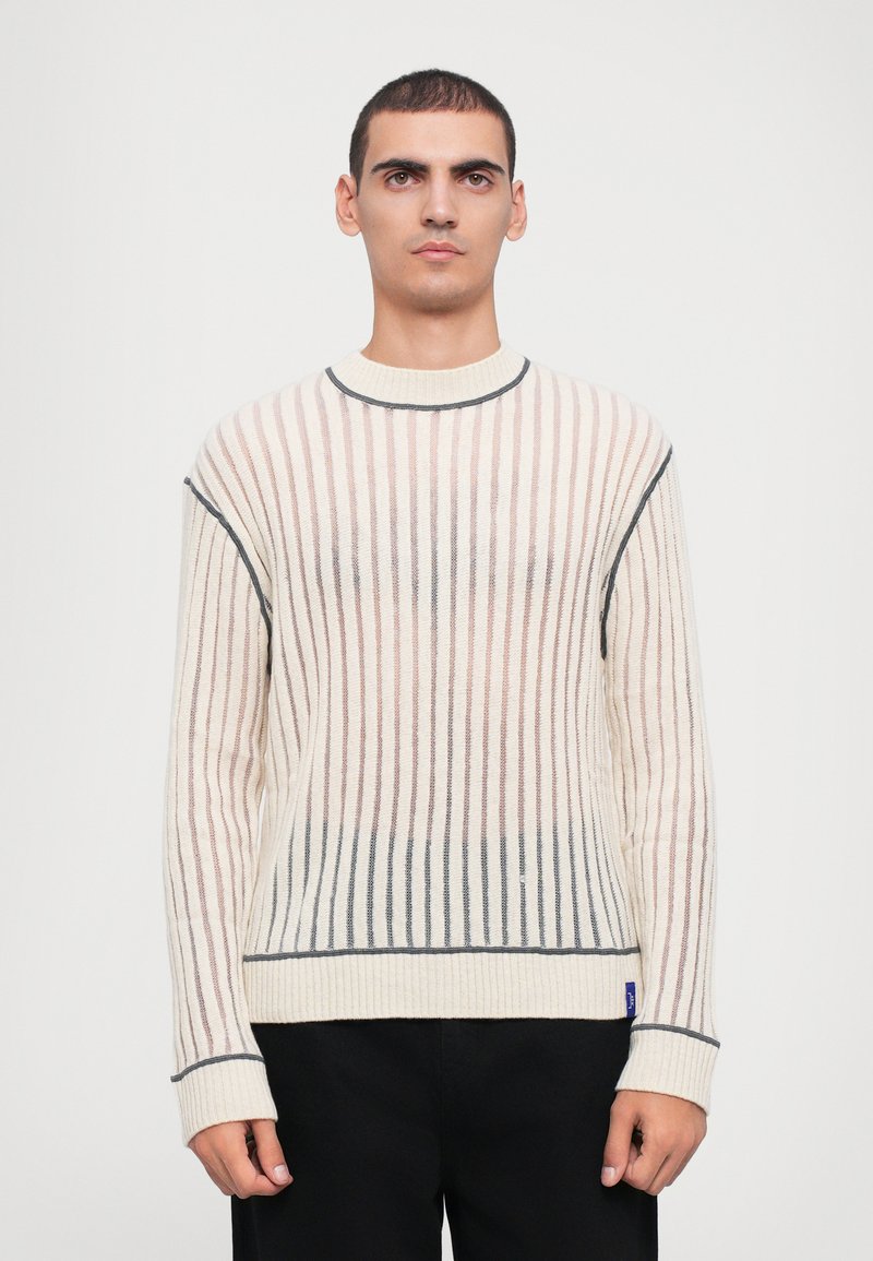 Cream knit sweater with vertical stripes in pastel pink and blue. Features a round neckline and light ribbing at cuffs and hem.