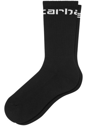 Schwarze Baumwollsocken mit geripptem Textur und weißem Branding am Bündchen. Entworfen für Komfort und Langlebigkeit.