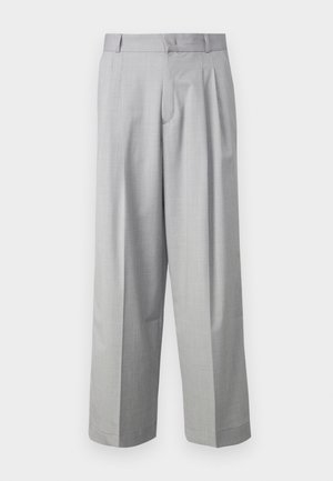 Heledad hallhallid püksid, mis on valmistatud siledast kangast, ees volditud ja küljeosades taskutega, kohandatud vöökoha kujundusega.