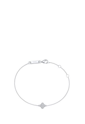 Delicate silver chain bracelet with a small clover-shaped charm adorned with tiny clear stones and a lobster clasp closure.