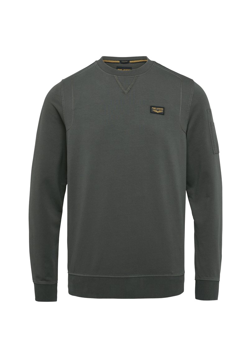 Sweatshirt vert foncé à manches longues, avec des côtes au niveau des poignets et de l'ourlet, arborant une petite étiquette sur la poitrine et une poche sur la manche gauche.
