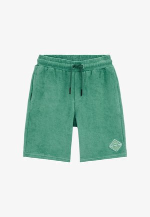 Zelene bermude od frotira s uvezivanjem u struku i bočnim džepovima, s zakrpom "Sunce i zabava" blizu ruba.