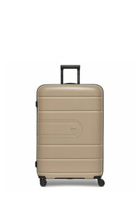 Valigia rigida color beige chiaro con finitura testurizzata, dettagli neri, quattro ruote per la mobilità e manico retrattile.