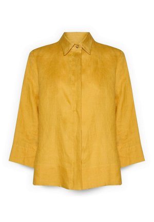 Mosterdgele blouse met knopen, een puntkraag en driekwartsmouwen, gemaakt van gestructureerde stof.