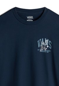 Navy blue loose-fit t-shirt made of cotton, featuring a graphic logo on the left chest with white and light blue details.