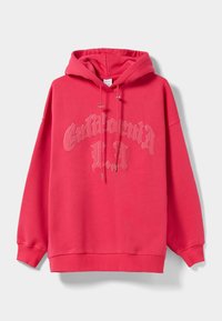 Růžová mikina s kapucí, která má na přední straně potisk s nápisem "California LA", se šňůrkami a žebrovanými manžetami. Měkký, pohodlný materiál.