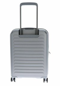 Valigia rigida grigia con modelli a righe verticali, manico telescopico e quattro ruote per la mobilità. Dotata di chiusura con zip.