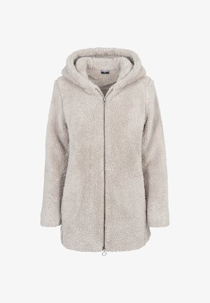 Bézs színű, hosszú ujjú kapucnis dzseki puha, bolyhos anyagból, teljes hosszúságú elülső cipzárral és gyűrűs húzófülekkel.