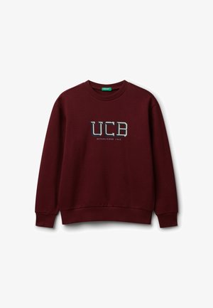 Felpa girocollo color marrone scuro con polsini e orlo a coste, che presenta il testo "UCB Fondato nel 1965" centrato sul petto.