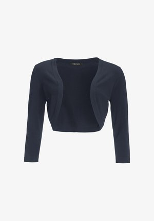 Cardigan court bleu marine, manches longues, tissu doux, design ouvert à l'avant, sans fermetures, texture lisse, style minimaliste, étiquettes visibles à l'intérieur.