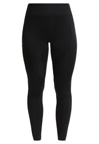 Zwarte sportlegging gemaakt van rekbaar materiaal, met textuurpanelen, een hoge tailleband en stikdetails voor een aangesloten silhouette.