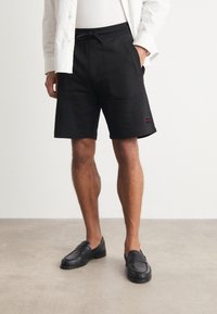 HUGO Pantalon de survêtement - black