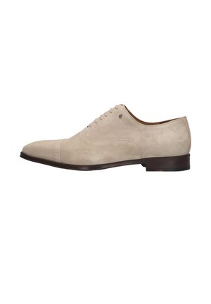 Light beige suede men's oxford shoe with closed lacing, cap toe, and dark brown low heel and sole.