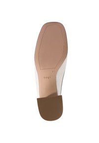White shoe sole with a smooth finish, featuring a rubber heel and embossed brand logo. Contours show a slight curve and textured grip.