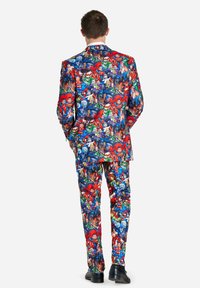 Colorful superhero printed suit featuring a mix of comic characters on a blue background, with matching trousers and a tailored fit.