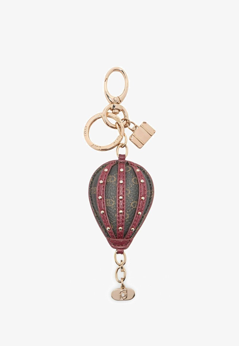 Leather hot air balloon keychain in burgundy and black with gold-tone rings and studded details, featuring a clasp and logo accents.