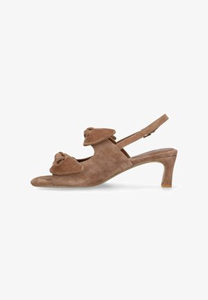 Brown suede open-toe slingback sandal with low curved heel and knotted bow details on front and top straps.