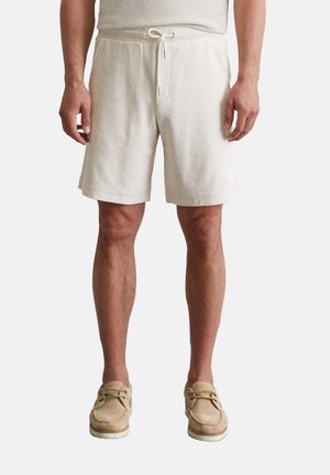 REGULAR - Tracksuit bottoms - puritan
