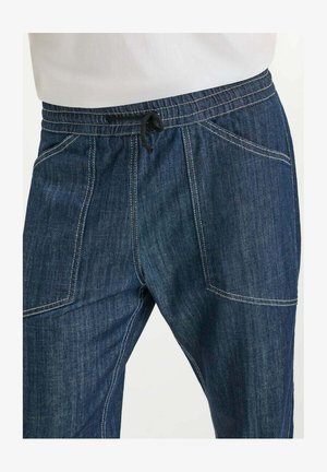 Donkerblauwe denim joggerbroeken met een elastische tailleband, trekkoord en twee voorzakken met contrasterende stikdetails.