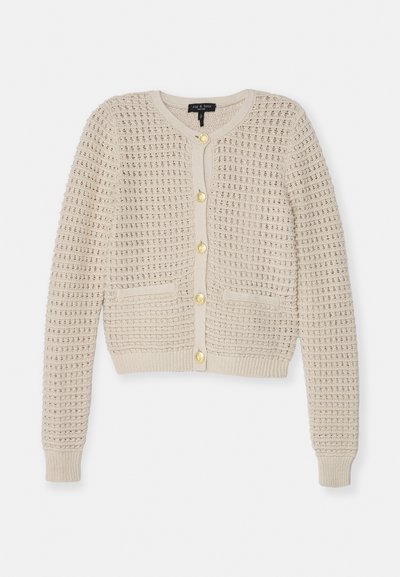 Beige villatakki, jossa on teksturoitu neulekuosi, pitkät hihat, pyöreä pääntie, kultaiset napit ja kaksi etutaskua.