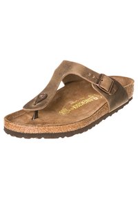 Ruske nubuk kengät flip-flop -tyyliin, jossa on korkkipohja, pronssinvärinen solki ja sileä varvasosa. Liukuestepohja.