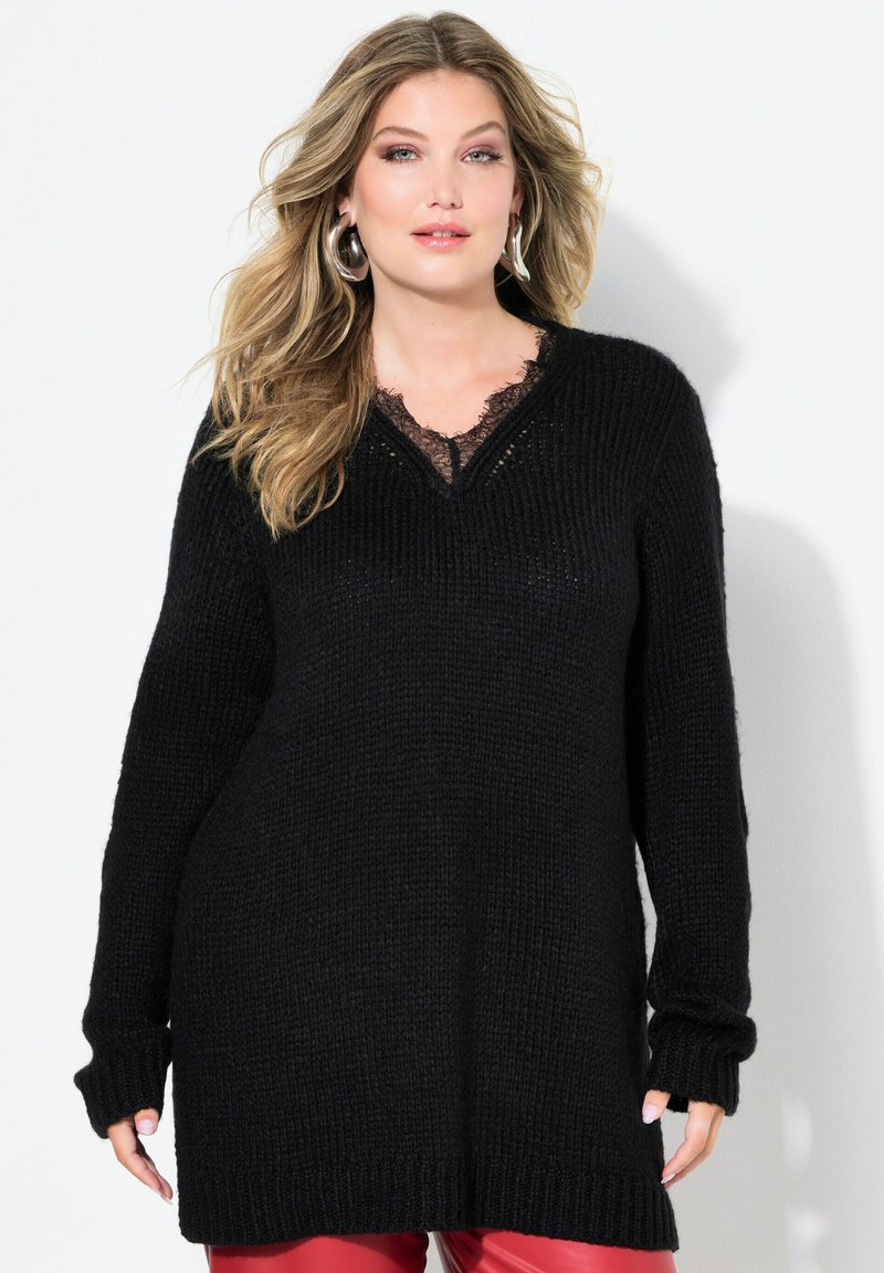 Schwarzer Strickpullover mit V-Ausschnitt und Spitzenbesatz, langen Ärmeln mit gerippten Bündchen und einem oversize Schnitt für hohen Komfort.