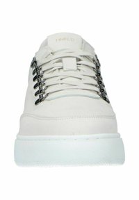 White sneaker with a smooth suede upper, featuring decorative metal hardware on the laces, a white rubber sole, and minimal branding.