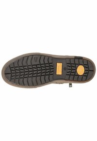 Zwarte rubberen zool met diepe profielpatronen, voorzien van een gestructureerd oppervlak en een tan accentlabel. Inclusief een gevormd logo en gripdetails.
