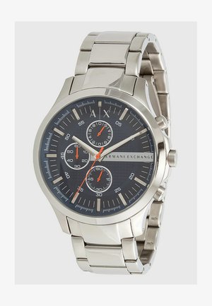 Silberner Edelstahlarmbanduhr mit einem dunkelblauen strukturierten Zifferblatt, drei Unterzifferblättern, silbernen Stundenmarkierungen und orangen Akzenten. Metallarmband.