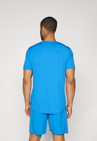 Under Armour TRAIN - T-Shirt sport - blue atlantis/high vis yellow