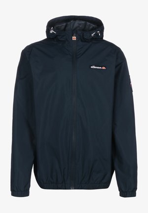 Marineblå hættetrøje med lynlås foran, elastiske manchetter og ellesse-logopatch på bryst og ærme.