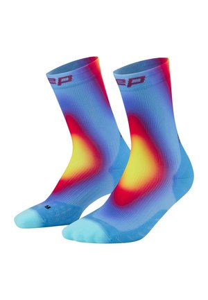 Pair of blue crew socks with heat map color pattern in red, yellow, and purple, showing toe and cuff details against white background.