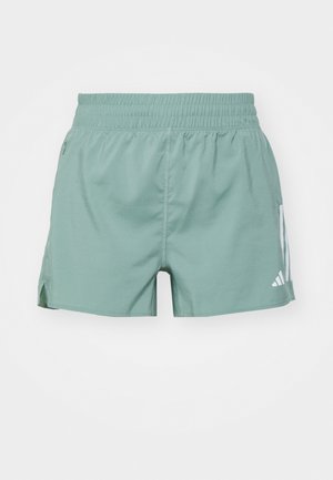 Groene sportshorts met een elastische tailleband, zijsplitten en witte logoaccenten aan één kant. Glad materiaal met een aansluitende pasvorm.