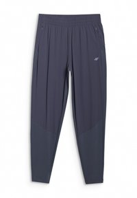 Pantalon de sport gris foncé avec taille élastique, poches latérales zippées et panneaux en tissu contrastant sur le bas des jambes.