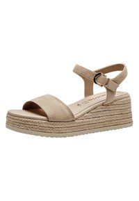 Beige platform sandals with a suede upper, wide front strap, ankle strap with buckle, and woven jute texture on the wedge sole.