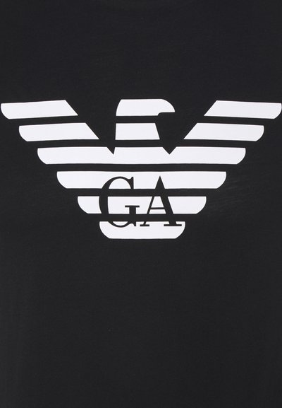 Black t-shirt featuring a white graphic design of horizontal stripes forming an eagle shape, with "GA" in bold lettering below.
