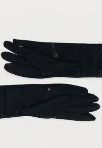 Ζευγάρι κομψά μαύρα γάντια με οθόνη αφής, με κολλητά μανίκια και μικρές αντανάκλαστικές λεπτομέρειες στο πίσω μέρος των δακτύλων.