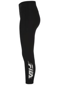 Svarta leggings med hög midja. Har ett vitt grafiskt mönster på underbenet. Tillverkade av ett elastiskt, slätt material.
