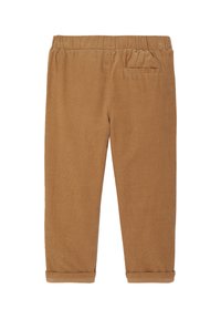 Brown corduroy pants with an elastic waistband, featuring a single back pocket and rolled cuffs. Texture is ribbed and soft.