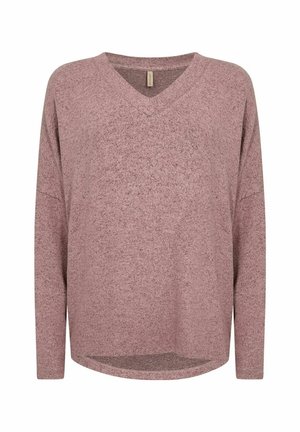 Pull à manches longues et col en V en tissu doux et texturé. La couleur est un mauve doux avec un ourlet légèrement arrondi et une coupe décontractée.