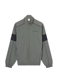 Szara kurtka przeciwdeszczowa z czarnymi akcentami, elastycznymi mankietami i zamkiem z przodu. Na piersi i rękawie znajduje się logo Champion. Lekki materiał.