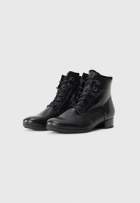 Black leather ankle boots with a rounded toe, lace-up front, and a small block heel. Smooth texture and minimalistic design details.