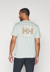 Helly Hansen SKOG GRAPHIC - Triko s potiskem - green mist