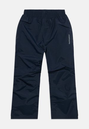 Tengerészkék vízálló nadrág elasztikus derékpánttal és kis Didriksons logóval a jobb combon, kültéri viseletre tervezve.